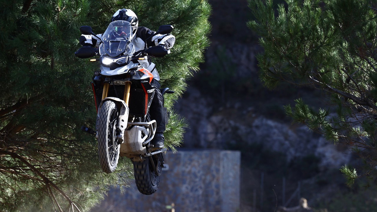 A motorcycle jumping through the air